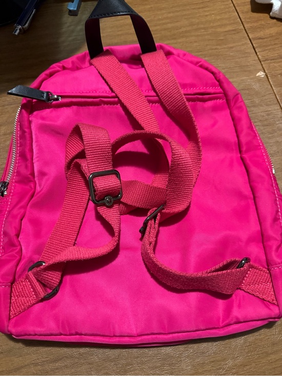 vibrant pink Kipling backpack